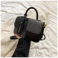 Piccola borsa quadrata alla moda in patchwork nero e grigio con manico rotondo e tracolla - Nero