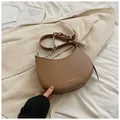Brown half-moon crossbody bag with silver chain and silk scarf decorative detail - Brown