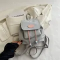 Light gray casual backpack with pink logo patch and beaded drawstring accents - No Pendant / Gray
