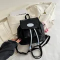 Mini black backpack in nylon fabric with blue logo and cute pink plush monster charm - With Pendant / Black