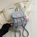 Light blue matte backpack with pink drawstrings and fuzzy monster charm for women - With Pendant / Blue