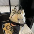 Contrast canvas and leather bucket bag in cream and black with cloud charm - With Ornament / Off White