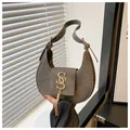 Detail of grey crescent underarm bag with gold metal letter buckle and fringe tassel - Dark Gray