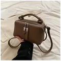 Dark brown lychee pattern leather Boston bag with silver hardware and top handle - Brown