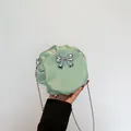 Petit sac rond plissé vert menthe avec nœud argenté et bandoulière en chaîne - Vert