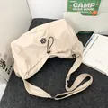 Chic beige pleated crossbody bag with drawstring details and wide shoulder strap - Off White