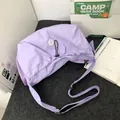 Lavender half-moon pleated shoulder bag with adjustable strap and hexagonal logo - Purple
