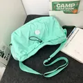 Mint green pleated crossbody bag with adjustable strap and drawstring closure for women - Green