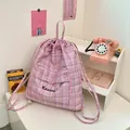 Pink and blue checkered drawstring backpack with quilted fabric and black embroidery - Pink