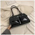 Glossy black shoulder bag with double front utility pockets and sleek top handles - Black