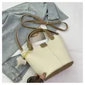 Beige and brown leather bucket bag with elephant charm and adjustable shoulder strap - Off White