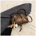 Brown oil-wax leather crossbody bag with vintage baseball charms and silver hardware - Brown with Pendant