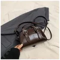 Dark brown faux leather crossbody bag with glossy finish and silver buckles - Coffee No Charm