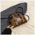 Brown oil wax leather mini satchel bag with buckle straps and a shoulder strap - Brown No Pendant