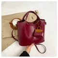 Burgundy faux leather tote bag with mini bag charm and detachable shoulder strap - Red