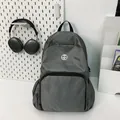 Minimalist grey nylon backpack with diamond grid texture and round logo for daily commute - Standard Type / Gray