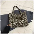 Stylish large leopard print faux fur tote bag with a minimalist wooden button closure - Coffee Leopard