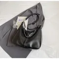 Black pebbled leather hobo bag with contrast stitching and metal chain strap - Black