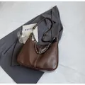 Deep brown faux leather hobo bag with white stitching and silver chain detail - Tan