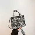 Gray leopard print square tote bag with dual handles and matching shoulder strap - Black
