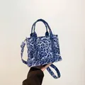 Blue leopard print mini tote bag with adjustable shoulder strap and handheld handles - Blue