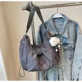 Dark gray nylon hobo crossbody bag with drawstring closure and plush cloud charm pendant - Gray