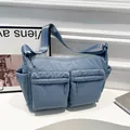 Sac bandoulière en nylon bleu avec plusieurs poches et bandoulière réglable - Bleu