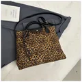 Leopard print tote bag with black leather handles and creative pretzel charm detail - With Pendant / Brown