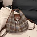 Brown plaid wool tote bag with leather straps on a beige coat for autumn style - Gray Plaid