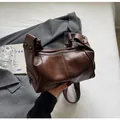 Retro dark brown leather underarm bag with glossy finish and silver rivet details - Coffee