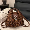 Leopard print tote backpack with brown leather trim and stylish wave edge detail - Leopard Brown