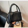 Retro black faux leather handbag with textured finish and detachable shoulder strap - Black