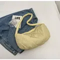 Pale yellow quilted dumpling bag with soft padding and rhombus texture design - Yellow