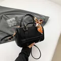 Black Boston bag in matte suede finish with gold hardware and printed silk scarf - Frosted Texture / Black Type 1