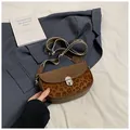 Retro brown saddle bag with leopard print panel and wide patterned strap - Khaki