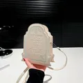 Cream tombstone shaped crossbody bag with spider web motif and embossed text - Off White
