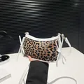 Chic leopard print underarm bag with white bow accents and adjustable shoulder strap - White