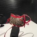 Leopard print baguette bag with red patent leather trim and bow details for women - Red