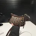Leopard print underarm bag with brown faux leather trim and bow detail for women - Brown