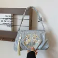 Silver-blue satin handbag with floral embroidery and elegant long tassel charm - Silver
