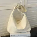 Chic beige hobo bag with marble texture finish and adjustable shoulder strap for women - Off-white