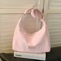 Pink crescent hobo bag in wrinkled fabric with adjustable strap and golden hardware - Pink