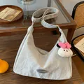Light grey hobo bag with pleated texture and cute white rabbit plush charm - Silver With Pendant
