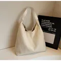 Chic off-white plush faux fur tote bag with white leather straps in a minimalist setting - Off White
