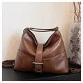 Dark brown retro hobo bag in glossy faux leather with decorative buckle and strap - Brown