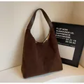 Brown teddy fleece tote bag with dark leather handles and spacious interior - Coffee