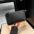 Chic black woven PU leather shoulder bag with silver bead trim and metal chain strap - Black