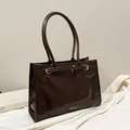 Vintage dark brown tote bag in glossy leather finish with adjustable metal buckles - Coffee