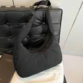 Black quilted nylon hobo bag with adjustable wide strap and buckle closure - Black