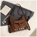 Vintage dark brown large leather tote bag with buckle pocket and woven charm detail - Brown with Pendant